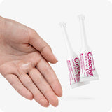 Hand displaying a small amount of Conceive Plus Fertility Lubricant, Pre-Filled Applicators (FR) on the palm, alongside two 4g applicators. Designed to support sperm viability and enhance conception, this French-labeled fertility product offers balanced pH and additional moisture.