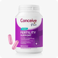 For Conceive Plus Ovulation Pack - Fertility + Ovulation Support (FR), image of single white bottle labeled "Women Fertility Support" in French and Dutch, with purple background and two pink capsules displayed in front, designed to aid women’s reproductive health with folic acid and essential nutrients.