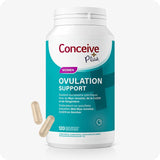 For Conceive Plus Ovulation Pack - Fertility + Ovulation Support (FR), image of a teal-labeled bottle of "Women Ovulation Support" with bilingual French and Dutch text, positioned upright with two beige capsules in front, formulated with Myo-Inositol, CoQ10, and ginger to support ovulatory health in women.